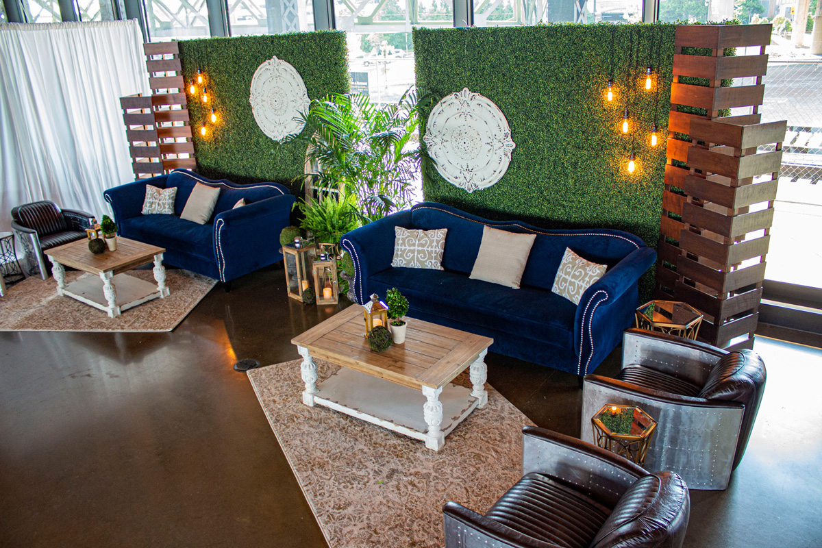 ampaevents_Furniture_Lounge_Zaffiro-Blue-Sofa_Alcott-Coffee-Table_Aviator-Chair_Boxwood-Wall_Market-string-lights_wood-slat-column_HR_IMG_5983_HR copy_1200px